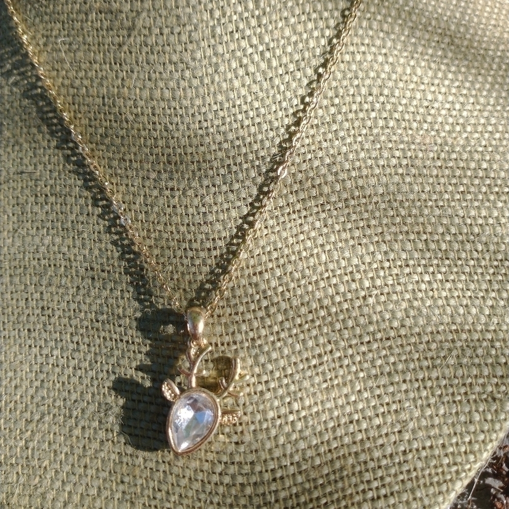 Women's gold tone deer necklace.